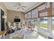Screened-in patio featuring comfortable seating and picturesque lake views, offering a serene outdoor retreat at 5012 Prato Loop # 5012, Myrtle Beach, SC 29579