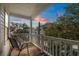 Balcony with wooden floor and white railings offering a serene outdoor retreat with sunset views at 6001 - 1125 S Kings Hwy., Myrtle Beach, SC 29575