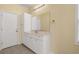 Bathroom with white cabinets, tile floor, large mirror, and good lighting at 6001 - 1125 S Kings Hwy., Myrtle Beach, SC 29575