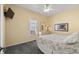 Cozy bedroom with carpet, ceiling fan, and dresser with mirror at 6001 - 1125 S Kings Hwy., Myrtle Beach, SC 29575