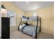 Bright bedroom featuring a bunk bed with blue and white striped bedding and a window at 6001 - 1125 S Kings Hwy., Myrtle Beach, SC 29575