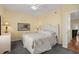 Cozy bedroom with carpet, complemented by a bed and furniture set against warm walls at 6001 - 1125 S Kings Hwy., Myrtle Beach, SC 29575