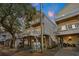 Two-story beach home featuring classic coastal architecture with elevated structure and private balconies at 6001 - 1125 S Kings Hwy., Myrtle Beach, SC 29575