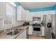 Bright kitchen with stainless steel appliances and white subway tile backsplash at 6001 - 1125 S Kings Hwy., Myrtle Beach, SC 29575