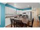Modern kitchen with white cabinetry, stainless steel appliances, and spacious dining area at 6001 - 1125 S Kings Hwy., Myrtle Beach, SC 29575