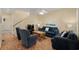 Comfortable living room with cozy seating arrangement, featuring a ceiling fan and staircase at 6001 - 1125 S Kings Hwy., Myrtle Beach, SC 29575