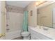 Well-lit bathroom features a shower-tub combo and white vanity with a decorative backsplash at 6001- 310 S Kings Hwy., Myrtle Beach, SC 29575