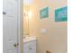 Bathroom featuring a vanity, mirror, and beach-themed wall art at 6001- 310 S Kings Hwy., Myrtle Beach, SC 29575