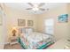 Cozy bedroom with a beach-themed decor, wicker furnishings, and a ceiling fan for added comfort at 6001- 310 S Kings Hwy., Myrtle Beach, SC 29575