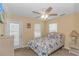 Bedroom featuring a ceiling fan, access to balcony and ocean themed bed spread at 6001- 310 S Kings Hwy., Myrtle Beach, SC 29575