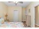 Bright bedroom with a ceiling fan, patterned bedspread, and wicker furniture at 6001- 310 S Kings Hwy., Myrtle Beach, SC 29575