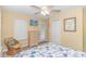 Bedroom features TV, outdoor access, wicker furnishings, and calming nautical decor at 6001- 310 S Kings Hwy., Myrtle Beach, SC 29575
