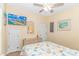 Comfortable bedroom with a TV, wicker furnishings, and warm lighting for a relaxing atmosphere at 6001- 310 S Kings Hwy., Myrtle Beach, SC 29575