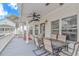Relaxing deck with ample seating and a ceiling fan for warm weather enjoyment, perfect for outdoor dining at 6001- 310 S Kings Hwy., Myrtle Beach, SC 29575