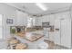 Bright kitchen with white cabinets, stone countertops, stainless appliances, and a cozy breakfast bar at 6001- 310 S Kings Hwy., Myrtle Beach, SC 29575
