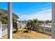 Balcony with comfortable seating and beautiful views of the sky, trees, and RV park at 6001- L08 S Kings Hwy., Myrtle Beach, SC 29575