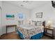 Comfortable bedroom features a decorative bed, wood floors, and a window view at 6001- L08 S Kings Hwy., Myrtle Beach, SC 29575