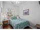 Cozy bedroom featuring wood floors, a ceiling fan and a comfortable bed at 6001- L08 S Kings Hwy., Myrtle Beach, SC 29575