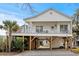Charming elevated home with a spacious porch and covered parking at 6001- L08 S Kings Hwy., Myrtle Beach, SC 29575
