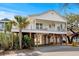 Charming elevated home with a spacious porch and ample covered parking area at 6001- L08 S Kings Hwy., Myrtle Beach, SC 29575
