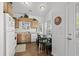 Eat-in kitchen with white appliances, wood cabinets, and a dining table at 6001- L08 S Kings Hwy., Myrtle Beach, SC 29575