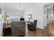 Bright living room featuring a vaulted ceiling, ceiling fan, and sliding doors to a balcony at 6001- L08 S Kings Hwy., Myrtle Beach, SC 29575
