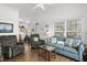 Open-concept living room with wood floors, comfortable seating, and access to the kitchen at 6001- L08 S Kings Hwy., Myrtle Beach, SC 29575