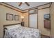 Cozy bedroom with floral bedding, framed artwork, and a view from the window at 6001-Mh26 S Kings Hwy., Myrtle Beach, SC 29575