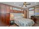 Bedroom with multiple windows, ceiling fan, tv, lamps, and plenty of storage at 6001-Mh26 S Kings Hwy., Myrtle Beach, SC 29575