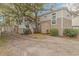 Charming home exterior with an outdoor shower, porch, and storage shed at 6001-Mh26 S Kings Hwy., Myrtle Beach, SC 29575