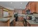 Well-equipped kitchen with wood cabinets and appliances at 6001-Mh26 S Kings Hwy., Myrtle Beach, SC 29575