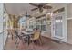 Relaxing covered porch with a dining table and ceiling fans at 6001-Mh26 S Kings Hwy., Myrtle Beach, SC 29575