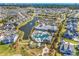 Expansive aerial view showcasing a community clubhouse, pool, and lush landscaping at 6096 Campanella St., Myrtle Beach, SC 29577