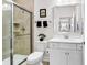 Bright bathroom with a glass-enclosed shower, modern vanity, and neutral tile at 6096 Campanella St., Myrtle Beach, SC 29577