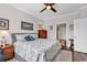 Comfortable bedroom has a ceiling fan and a cozy bed with soft bedding at 6096 Campanella St., Myrtle Beach, SC 29577