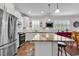 Eat-in kitchen island features a granite countertop and white cabinets at 6096 Campanella St., Myrtle Beach, SC 29577