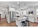Eat-in kitchen island features a granite countertop and white cabinets at 6096 Campanella St., Myrtle Beach, SC 29577