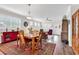 Open-concept living space with a view of the dining table and front entrance at 6096 Campanella St., Myrtle Beach, SC 29577