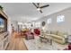 Spacious living room featuring hardwood floors, neutral walls, and a ceiling fan at 6096 Campanella St., Myrtle Beach, SC 29577