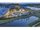 Aerial view of community pool area, featuring lush landscaping and relaxing views of the waterfront at 6096 Campanella St., Myrtle Beach, SC 29577