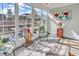 Sunroom filled with natural light showcases views, furniture and decor at 6096 Campanella St., Myrtle Beach, SC 29577