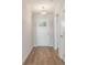 Bright entryway featuring wood-look flooring and a white front door with decorative glass at 633 Woodside Dr., Conway, SC 29526