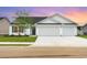 Charming single-story home featuring a spacious three-car garage and well-manicured front lawn at 633 Woodside Dr., Conway, SC 29526