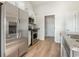 Modern kitchen featuring stainless steel appliances, white cabinetry, and granite countertops at 633 Woodside Dr., Conway, SC 29526