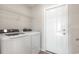 Convenient laundry room with modern washer and dryer next to a door at 633 Woodside Dr., Conway, SC 29526