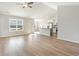 Spacious living room with wood-look floors, vaulted ceilings, and a view of the water at 633 Woodside Dr., Conway, SC 29526
