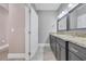 Bathroom boasts double vanity, granite counters, and tile flooring at 653 Whispering Pines Ct., Murrells Inlet, SC 29576