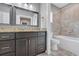 Bathroom boasts double vanity, granite counters, and tile flooring next to the shower and tub at 653 Whispering Pines Ct., Murrells Inlet, SC 29576