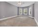 Bedroom features carpet, ceiling fan and triple windows at 653 Whispering Pines Ct., Murrells Inlet, SC 29576