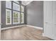 Bright bedroom features a large array of windows and beautiful tile flooring at 653 Whispering Pines Ct., Murrells Inlet, SC 29576